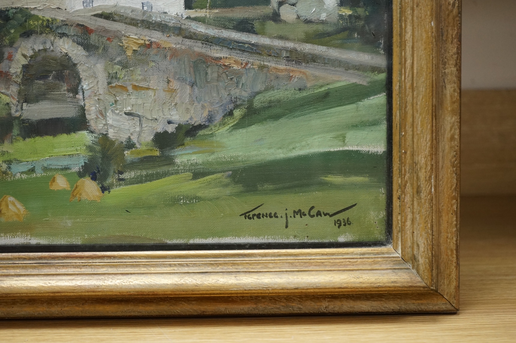 Terence J. McCaw (South African, 1913-1978), Village scene with stone bridge, signed and dated 1936, oil on canvas, 45 x 60cm